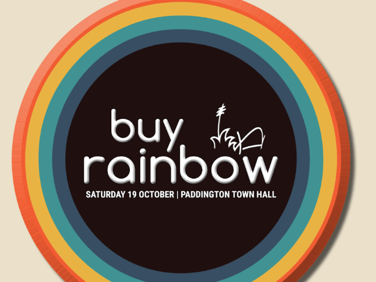 A circular rainbow-colored promotional poster for a sale event with the text 'buy rainbow' and details about a sale on Saturday, October 19th at Paddington Town Hall.