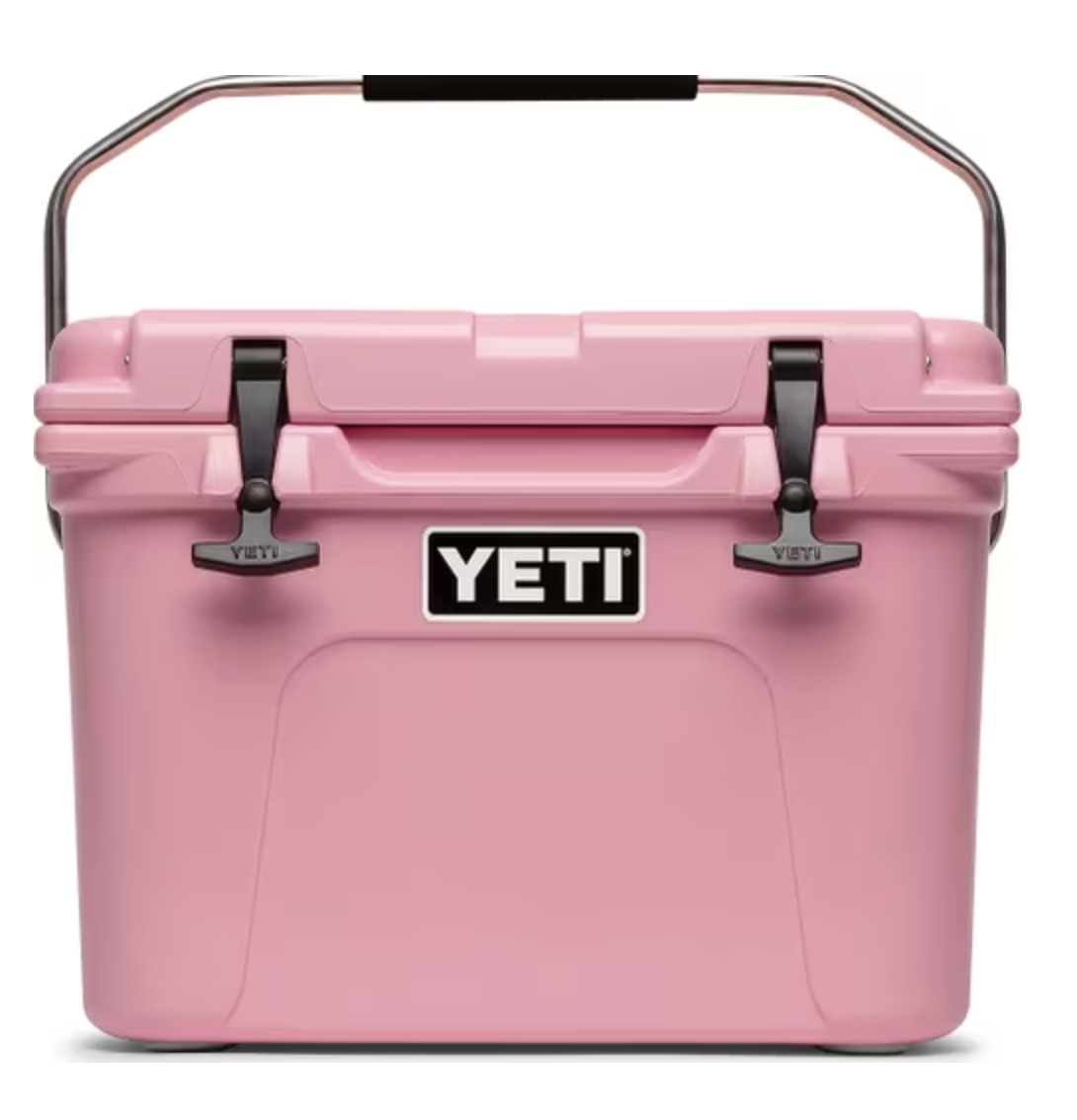 Pink YETI cooler with black latch and silver handle.