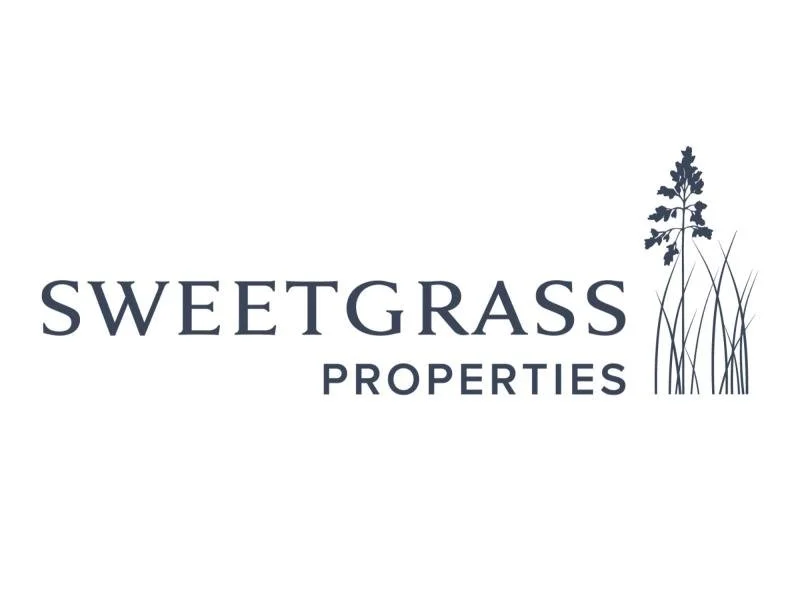 Logo for Sweetgrass Properties featuring the company name and a graphic of a sweetgrass plant.