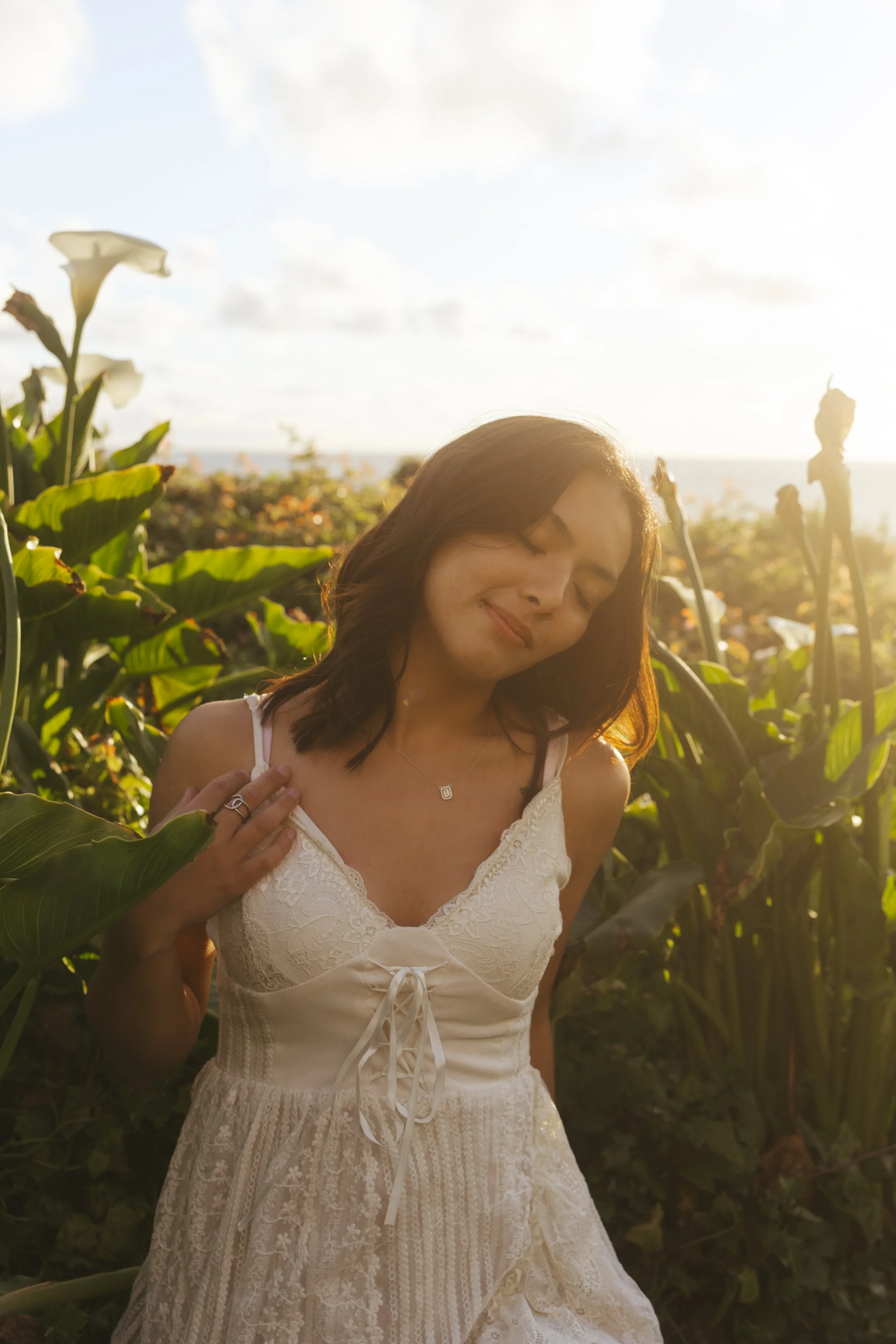 girl sitting in flower field