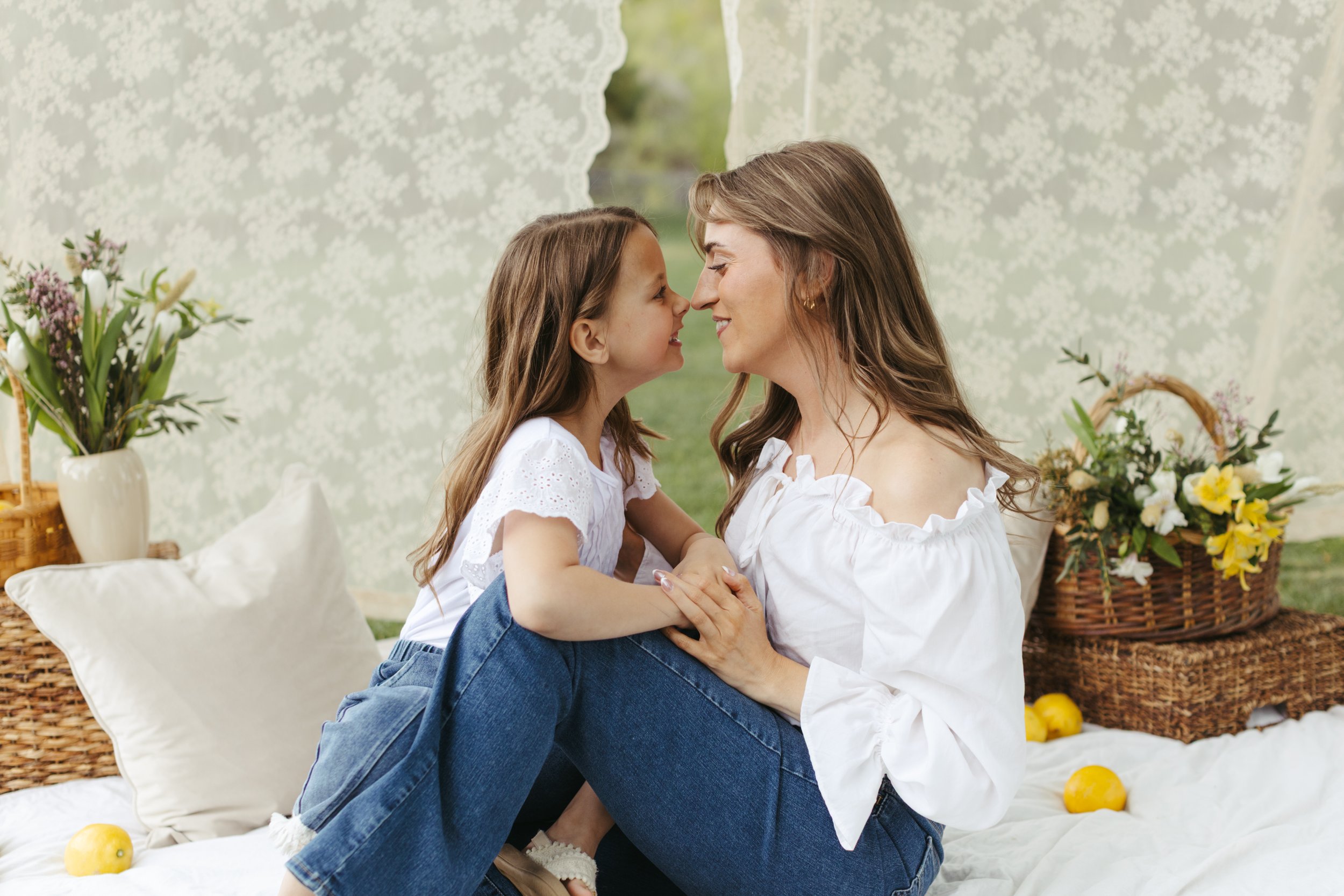 mother and daughter touching noses at rancho San Rafael park