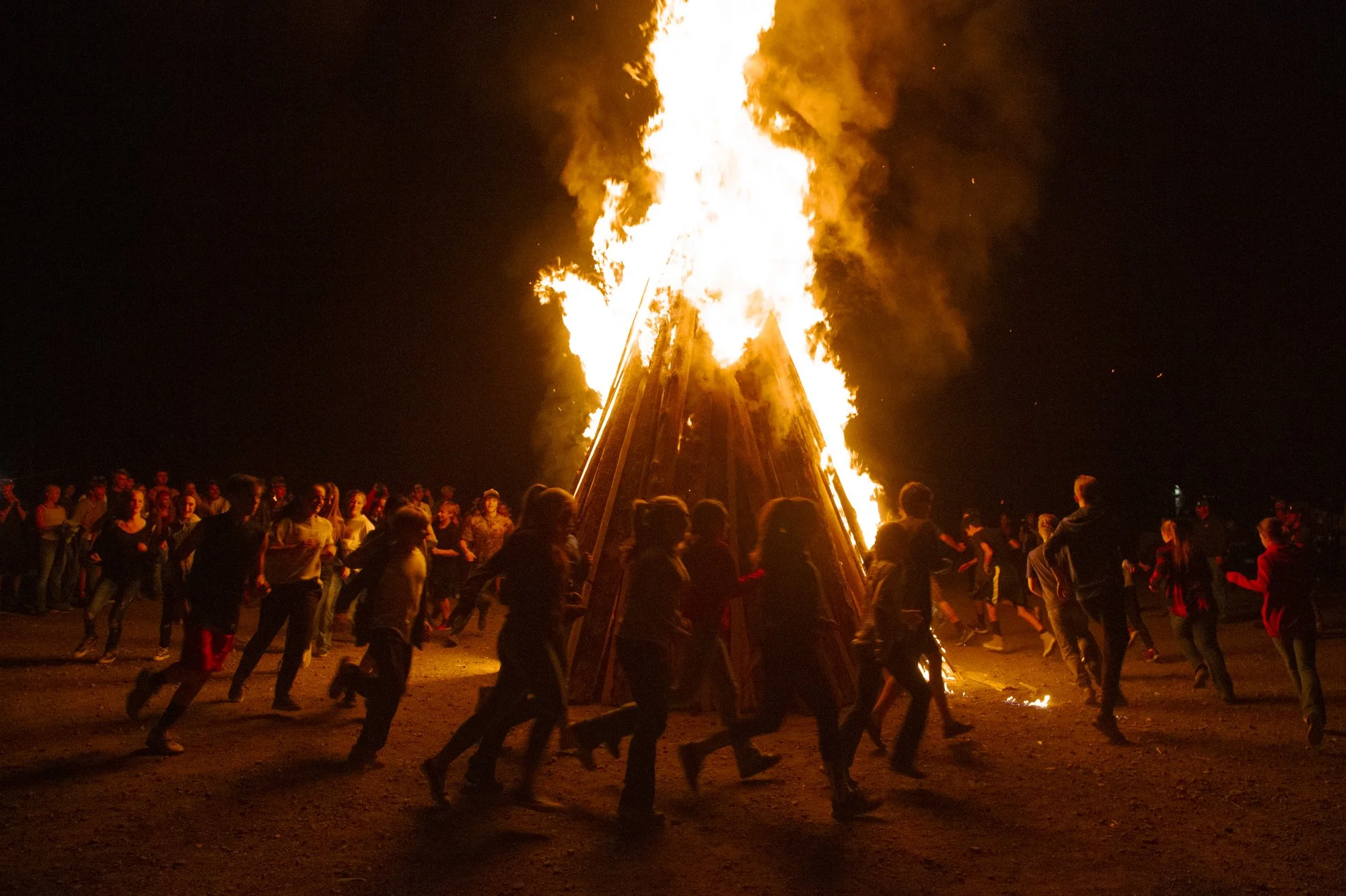 Paonia High School students celebrate homecoming with tradition. A "Peach Fuzz" volleyball game where participants dress up and compete by grade is followed by a huge bonfire on the school grounds. 
