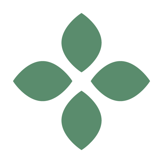A simple graphic logo with four green leaves arranged in a diamond shape.