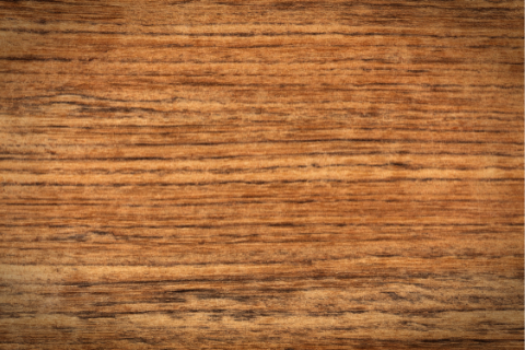 Close-up of a wooden surface with visible grain and texture.