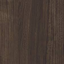 Close-up of a dark wood surface with visible grain patterns.