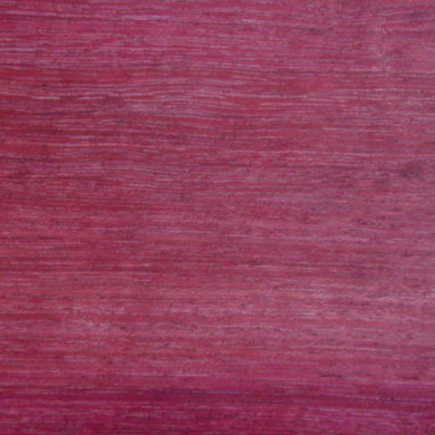 Close-up of a textured pink fabric surface.