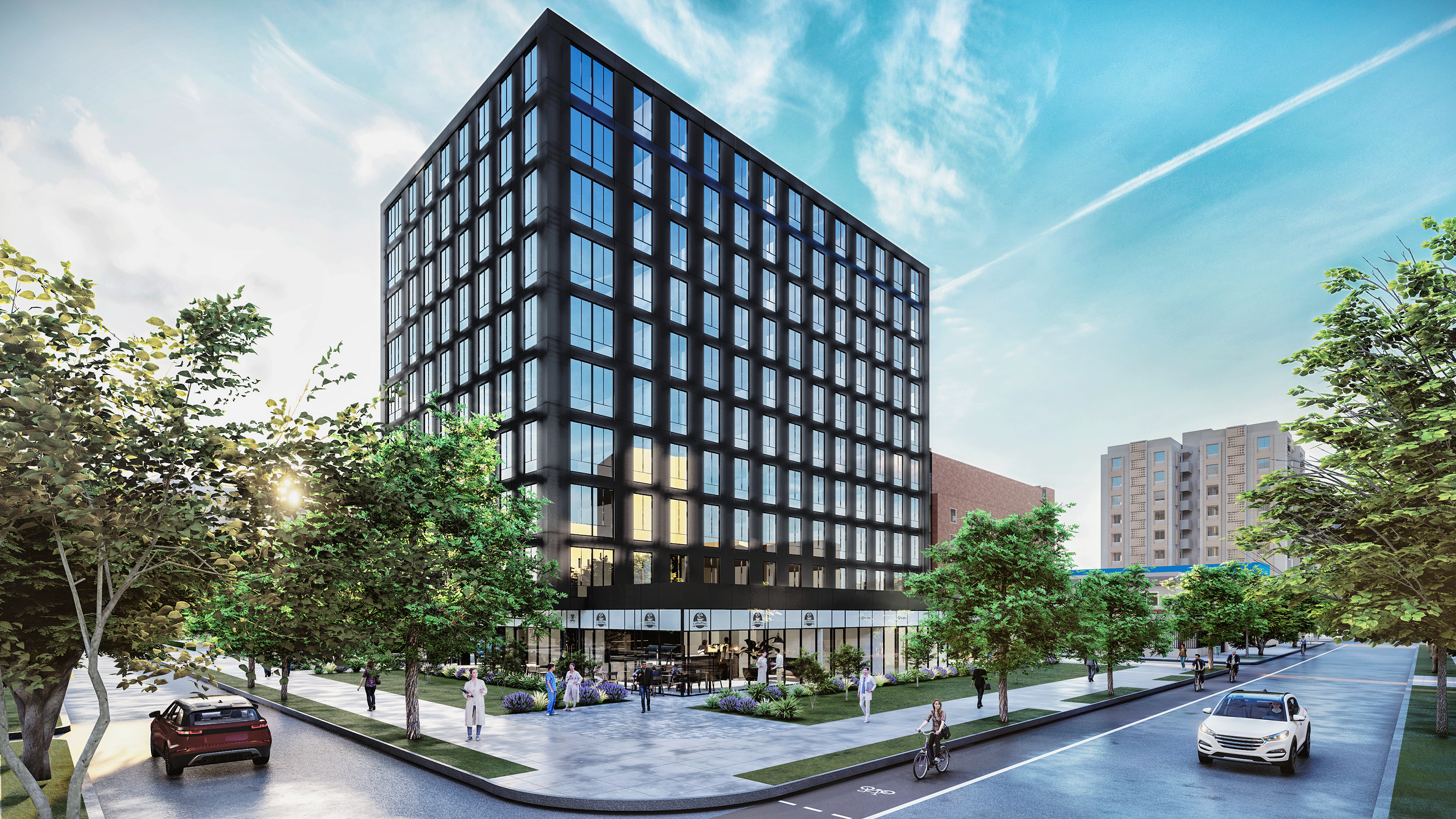 Modern multi-story office building with glass windows, surrounded by trees, pedestrians, and cars on a sunny day.