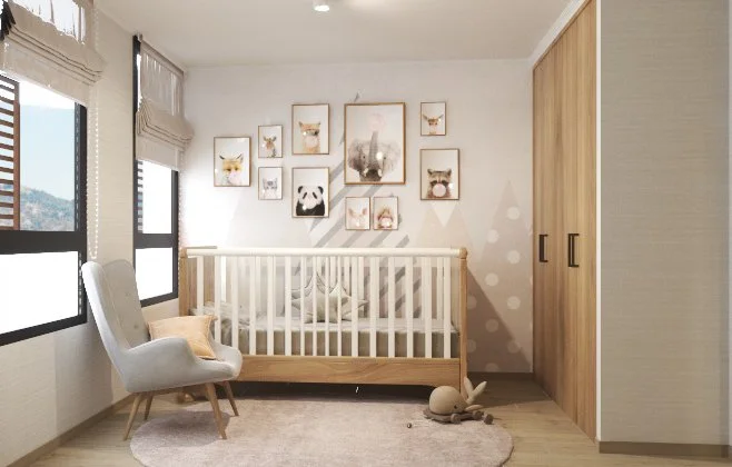 A nursery with a white crib, an armchair, a round rug, and a wall with framed animal pictures, including a panda, deer, and rabbits. There are two large windows with blinds and a wooden storage cabinet.