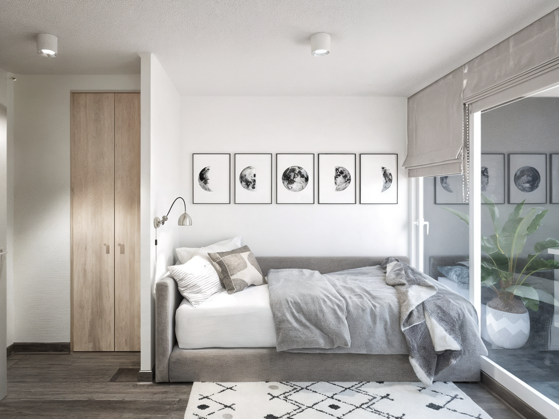 Modern bedroom with a grey bed, white walls, black and white moon phase artwork above, sliding glass door with a curtain, and potted plant outside.
