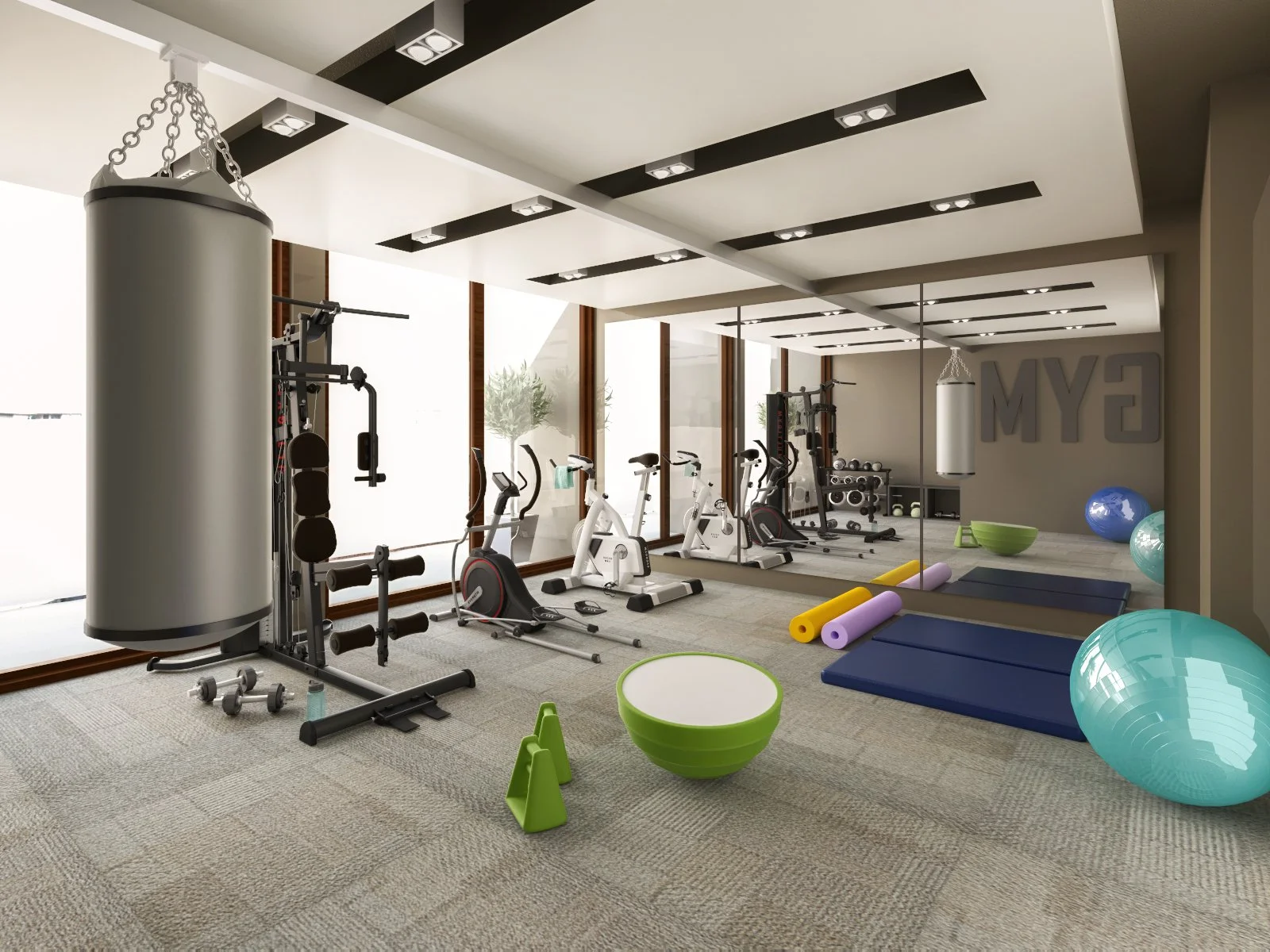 Indoor gym with exercise equipment including a punching bag, stationary bikes, treadmills, mats, stability balls, foam rollers, and dumbbells.