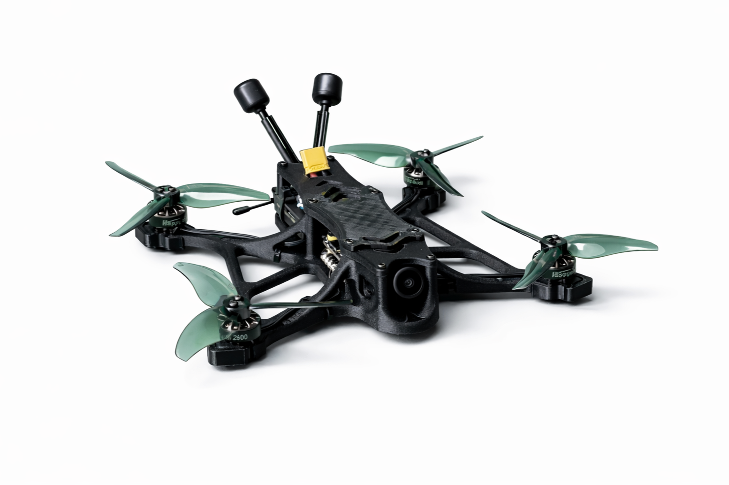 A black drone frame with four green propellers attached to motors on each arm