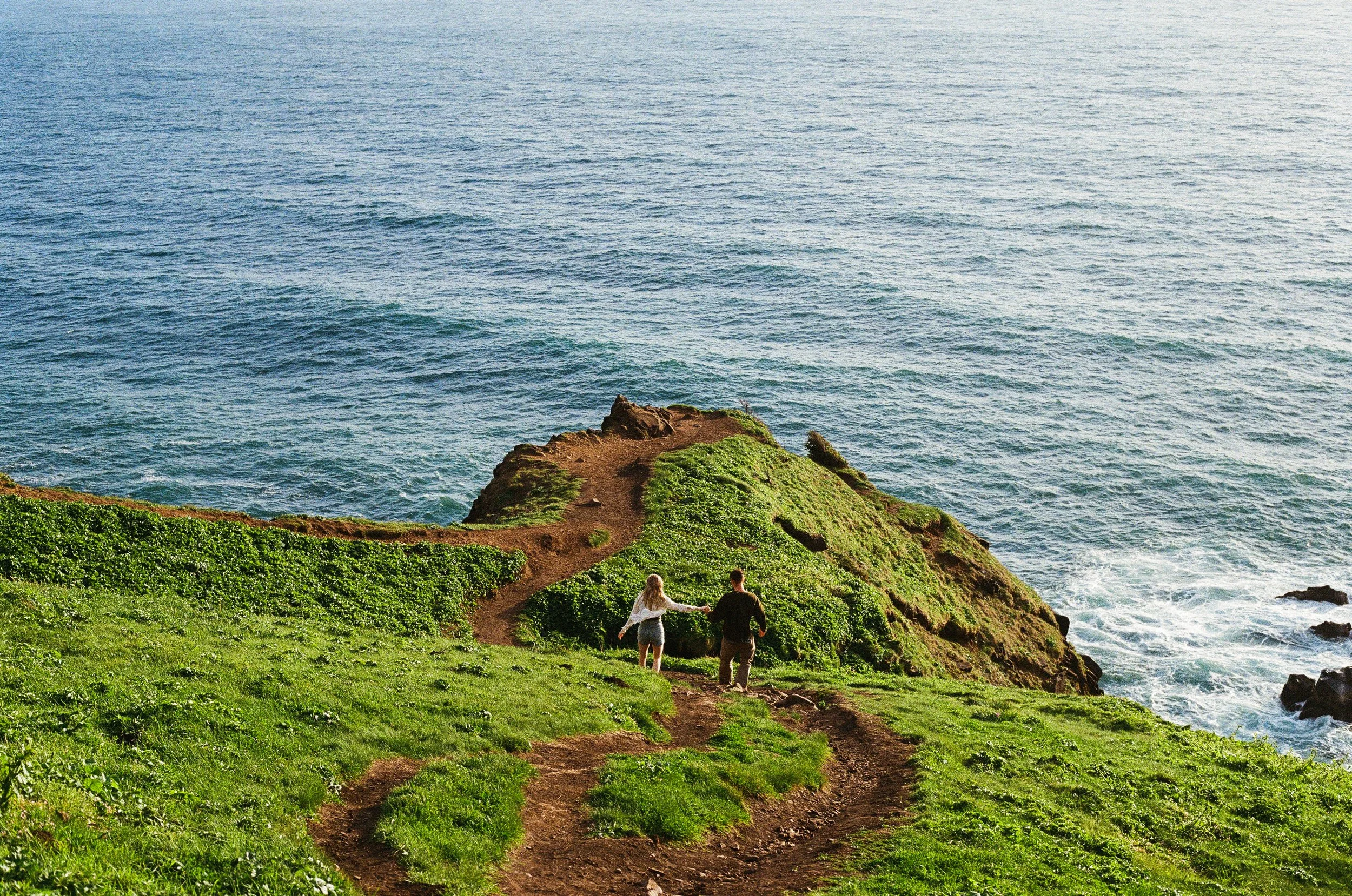 a couple running down to the cliffs at elk flats