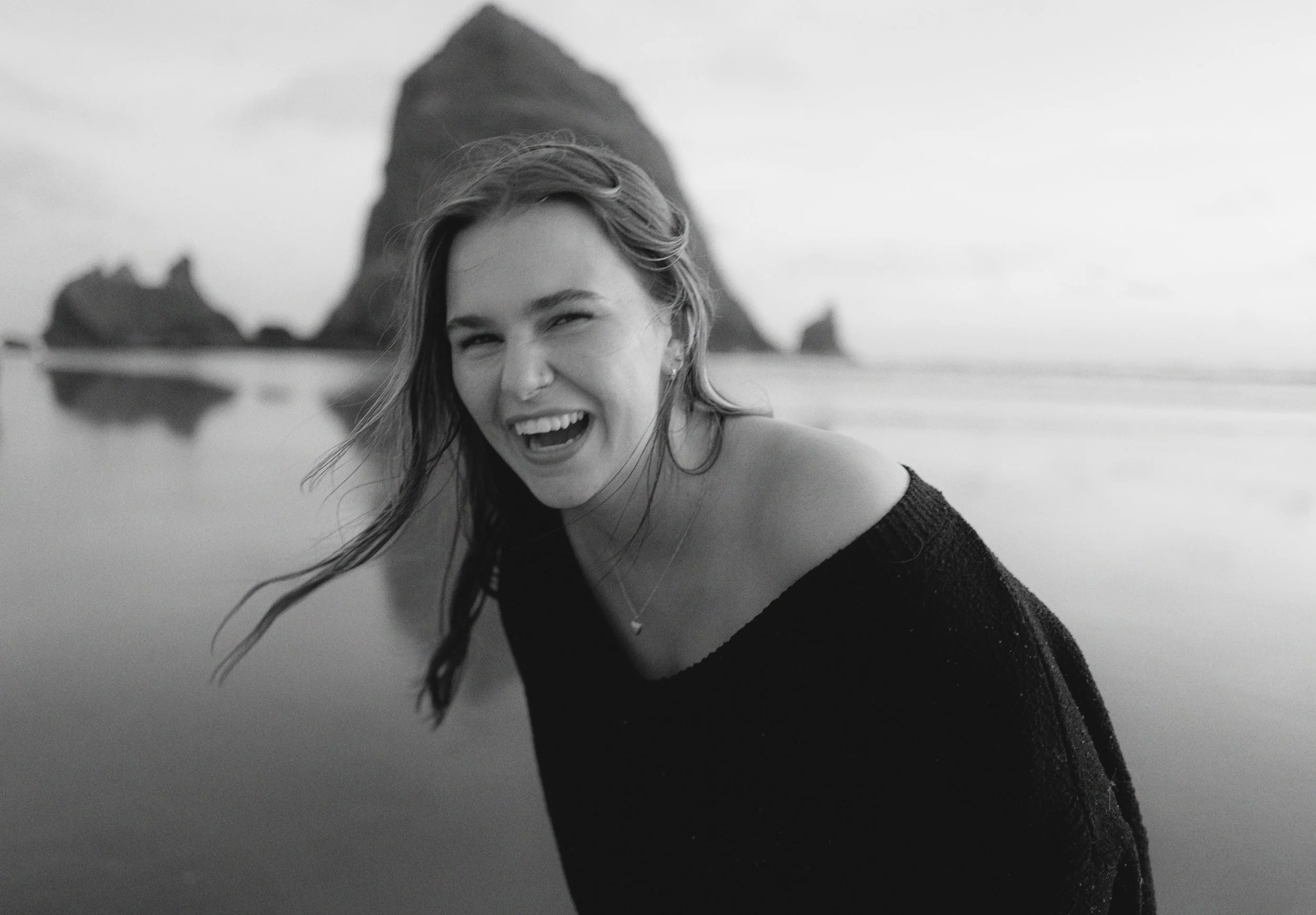 a bride laughing on the oregon coast candid on 35mm film photography