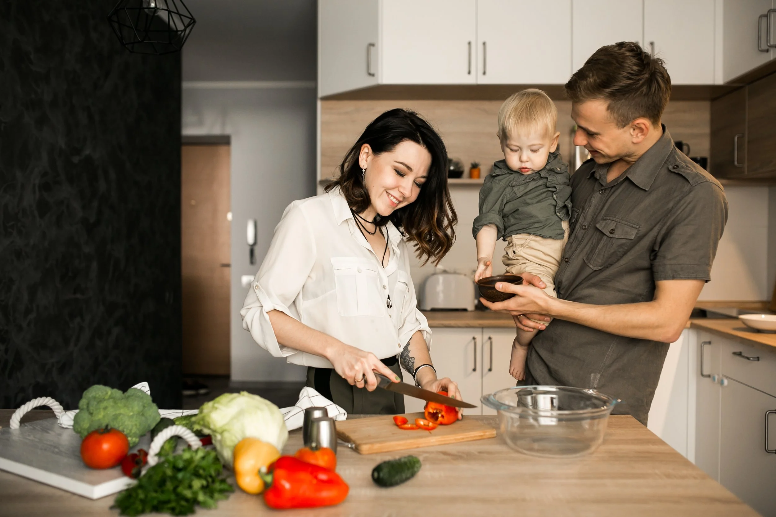 Family prepares a meal in the kitchen