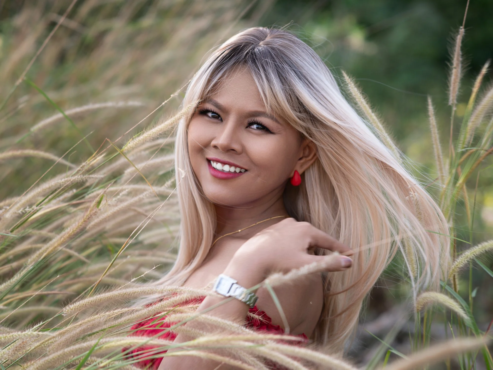 A pretty girl and some tall grass