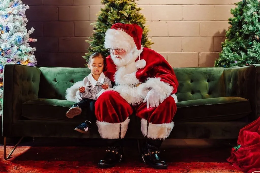 Santa Snow reads a Christmas card from a little girl