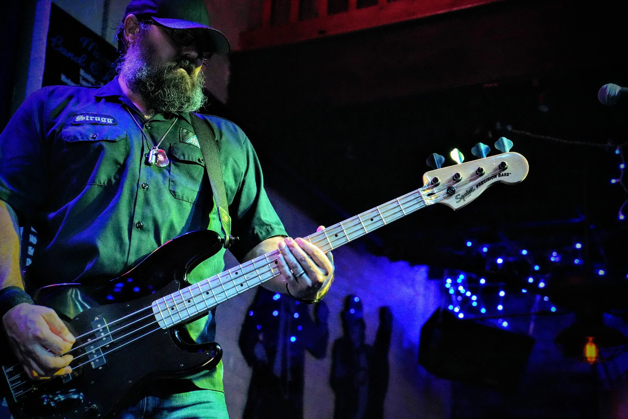 Strugg Lang, of The Cosmic Situation performing Bass Guitar live under the glowing lights of the world-famous Slippery Noodle in Indianapolis.