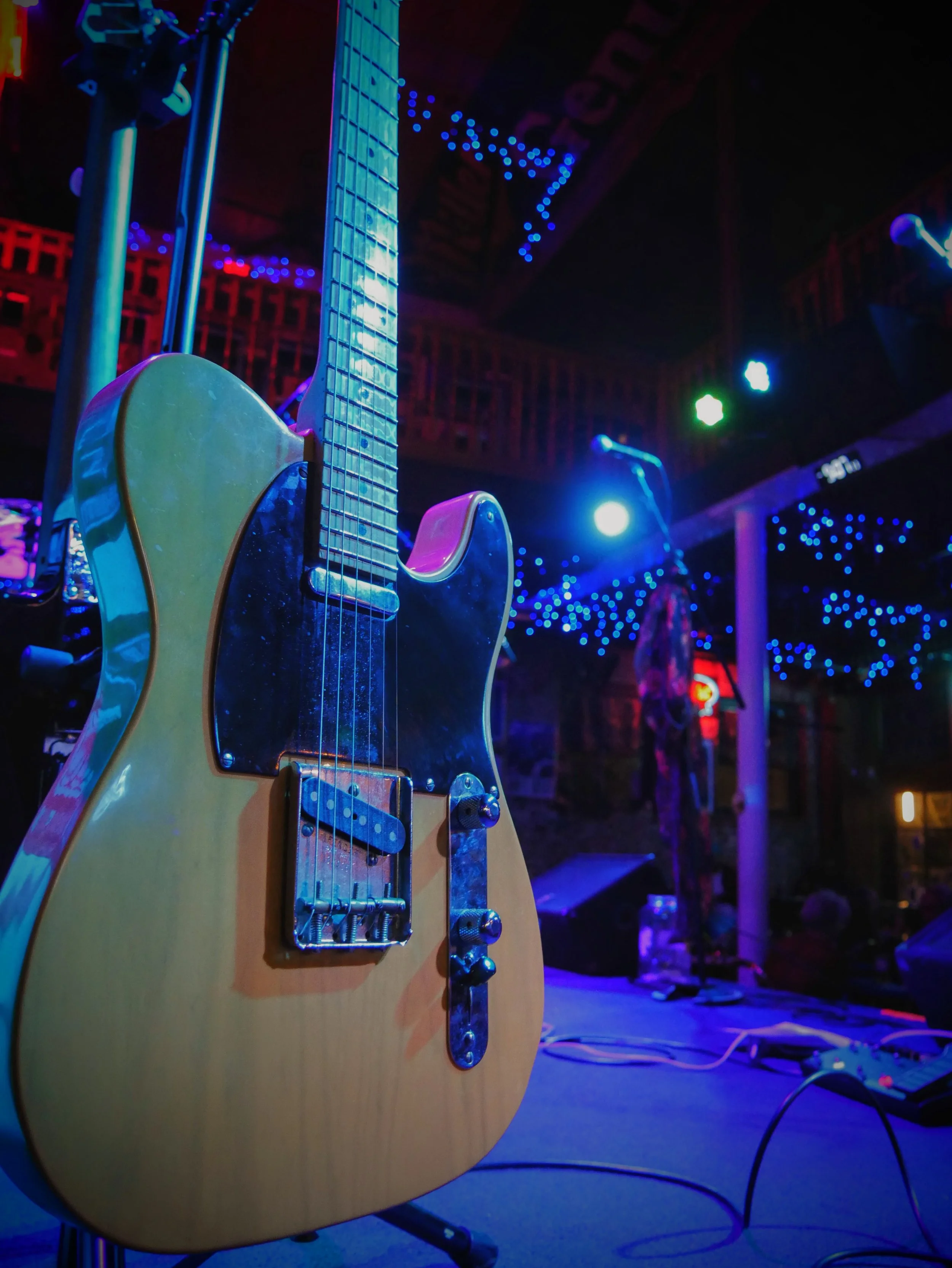 A classic Fender Telecaster during a music set break under the glowing lights of the world-famous Slippery Noodle in Indianapolis.