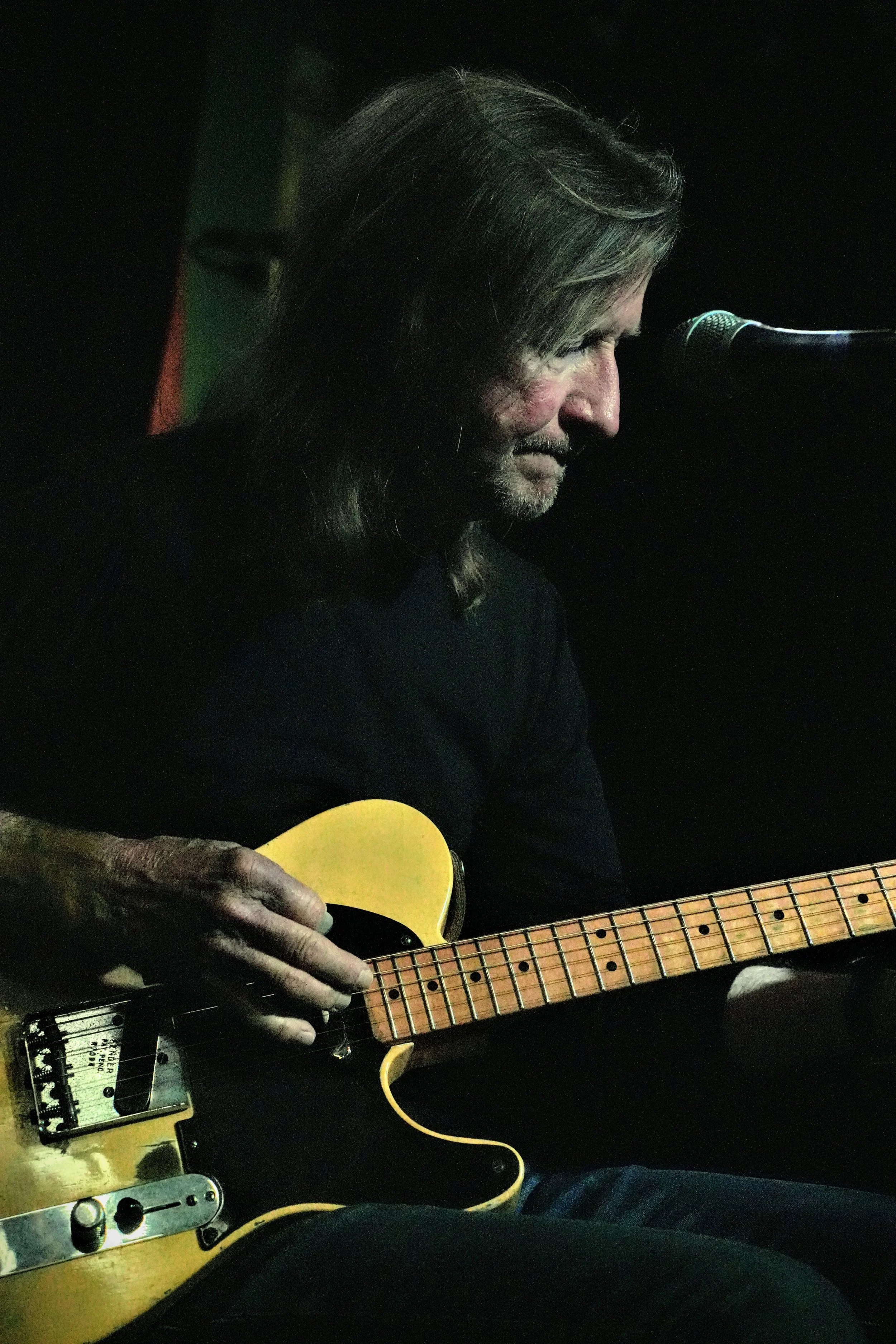 Gordon Bonham Jr. performing live on a classic Fender Telecaster under the glowing lights of the world-famous Slippery Noodle in Indianapolis.
