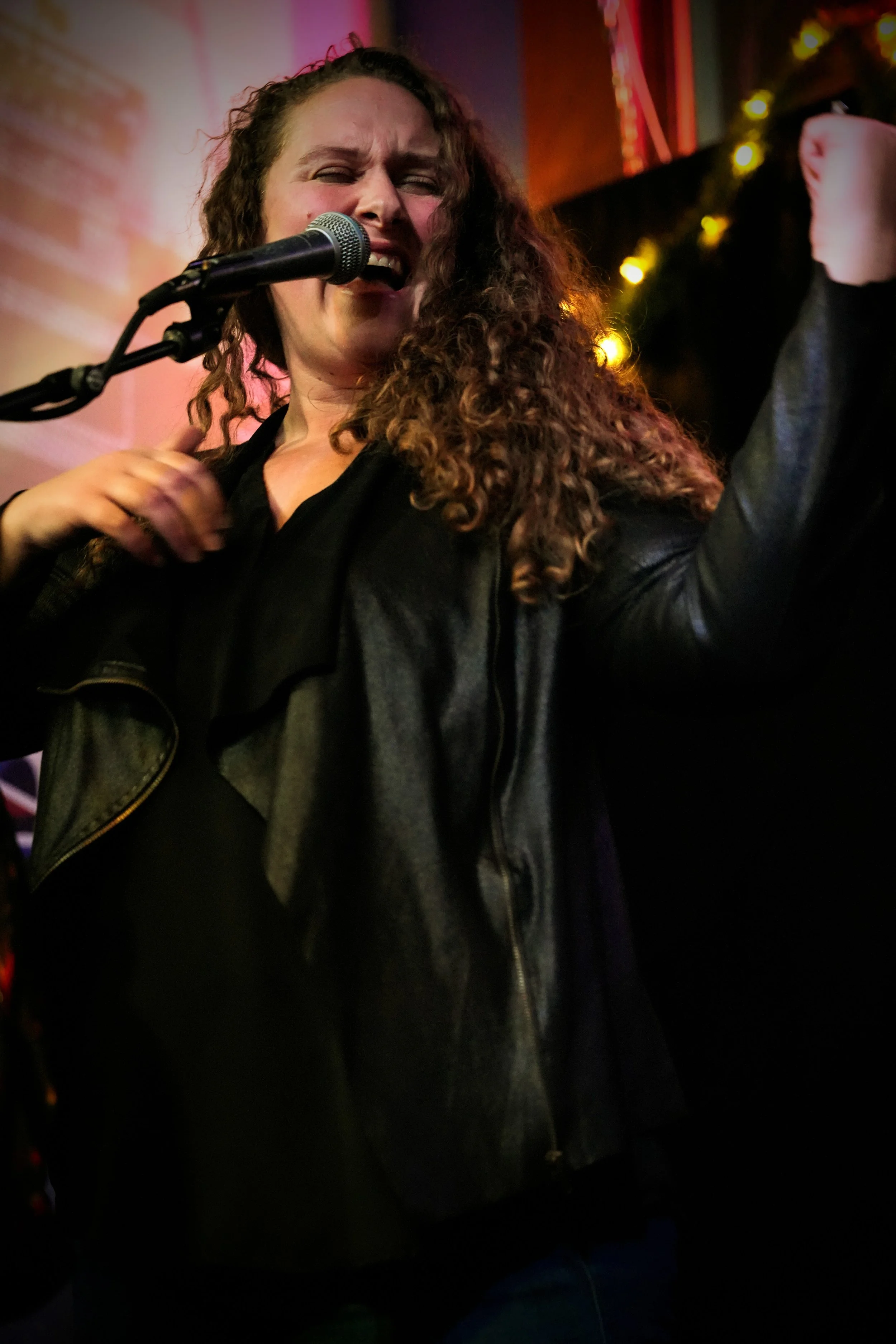 Sara 'Phoebe' of Phoebe and The MojoMakers with an electric performance under the glowing lights of the world-famous Slippery Noodle in Indianapolis.