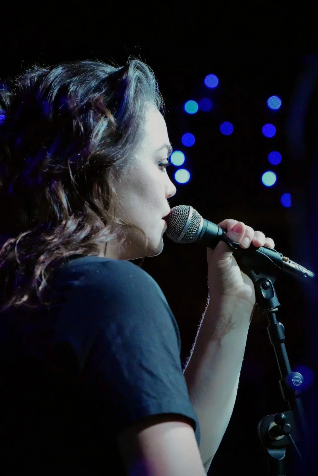 Natalie Marque performing soulfully as the band leader of GrooveSmash under the glowing lights of the world-famous Slippery Noodle in Indianapolis.