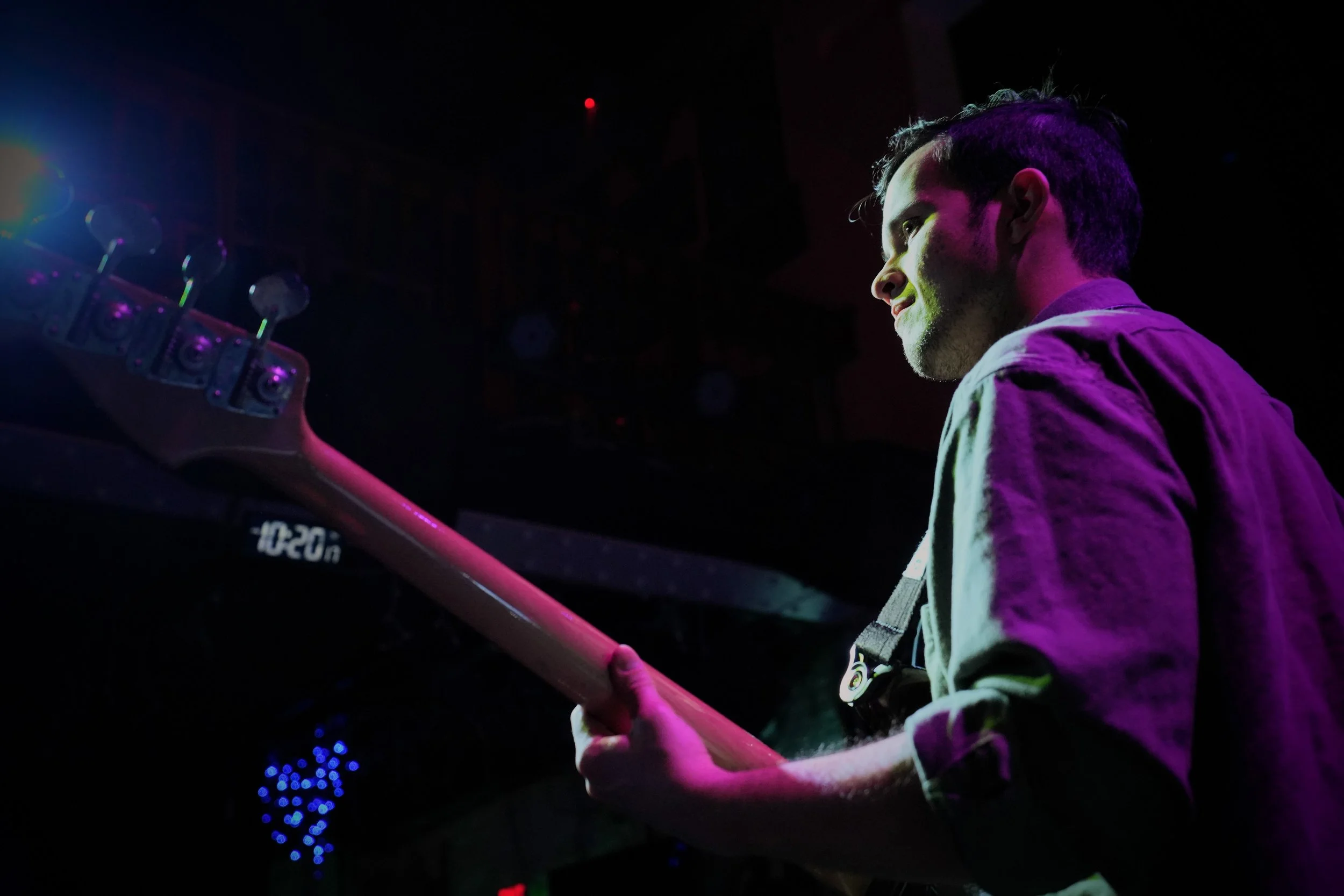 Jonah Lane performing performing live on Bass guitar under the glowing lights of the world-famous Slippery Noodle in Indianapolis.