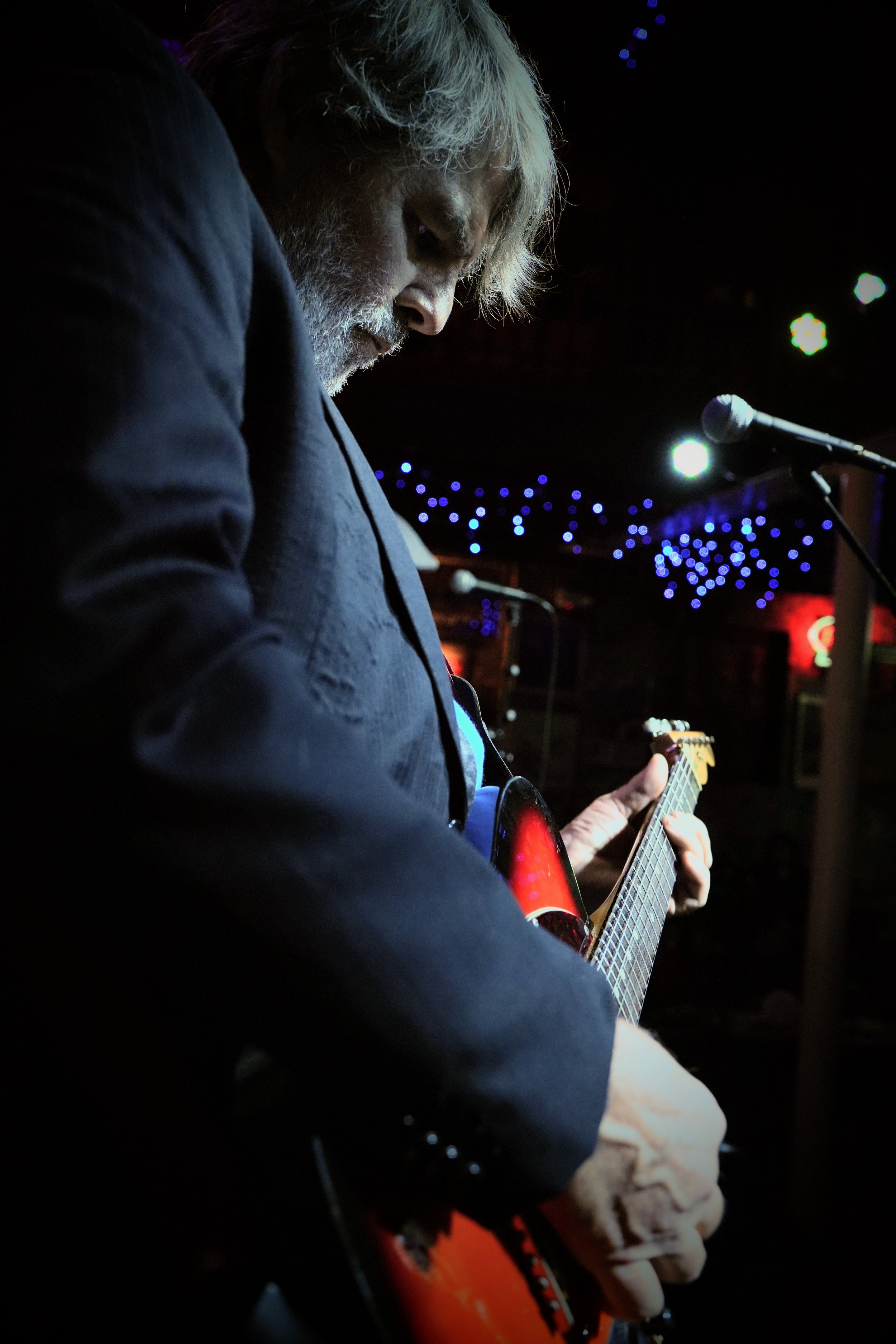 John Abel of Black Cat and the Bones performing live under the glowing lights of the world-famous Slippery Noodle in Indianapolis.