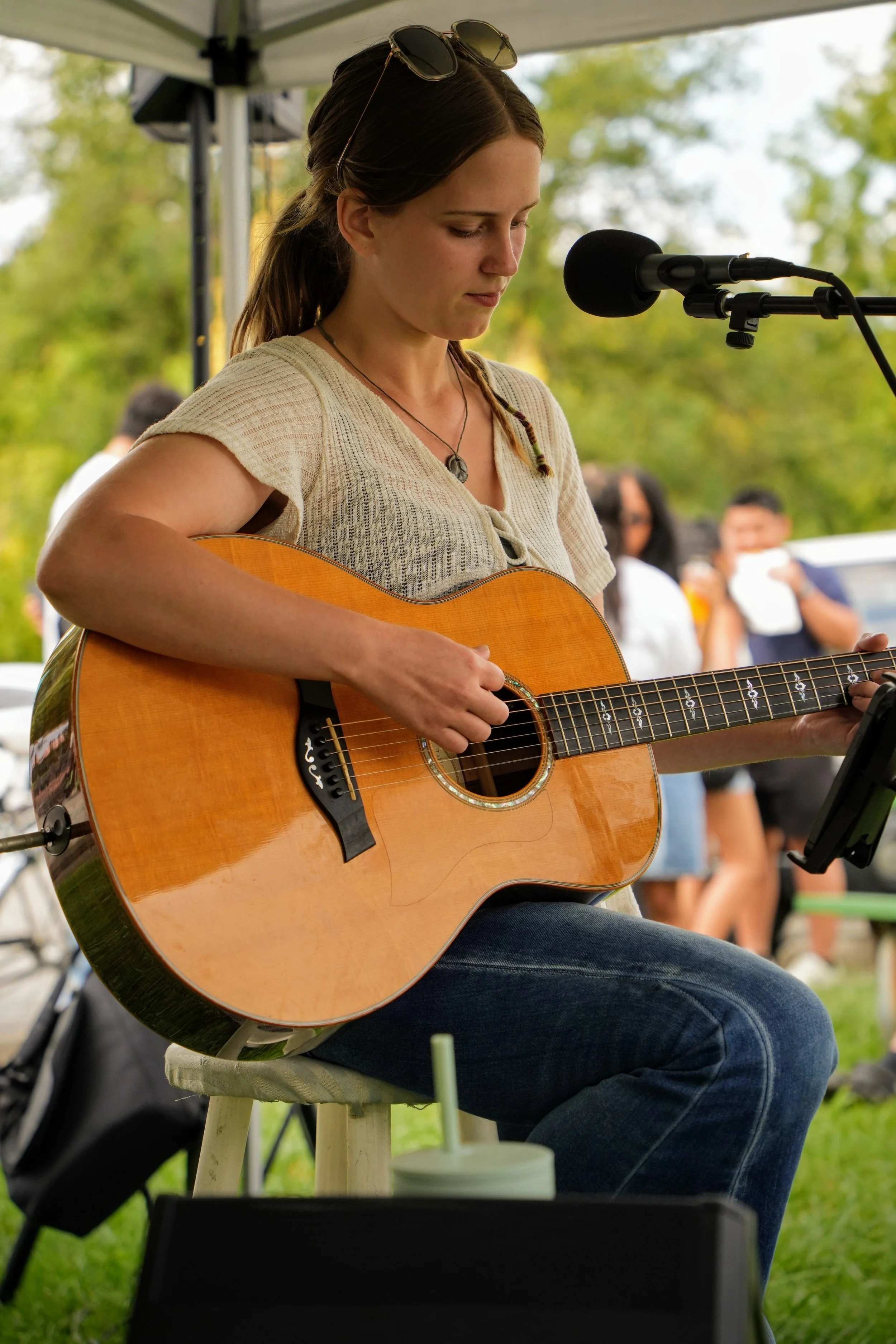 Rose O'Neal performing live music at the Garfield Park Farmer's Market in South Indy.