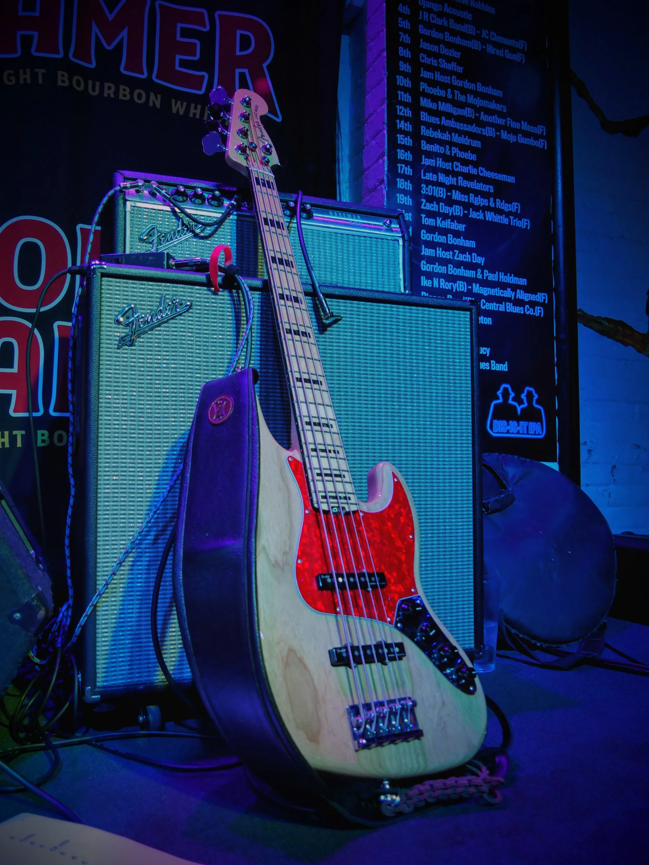 A classic Fender Jazz Bass rests between music sets under the glowing lights of the world-famous Slippery Noodle in Indianapolis.