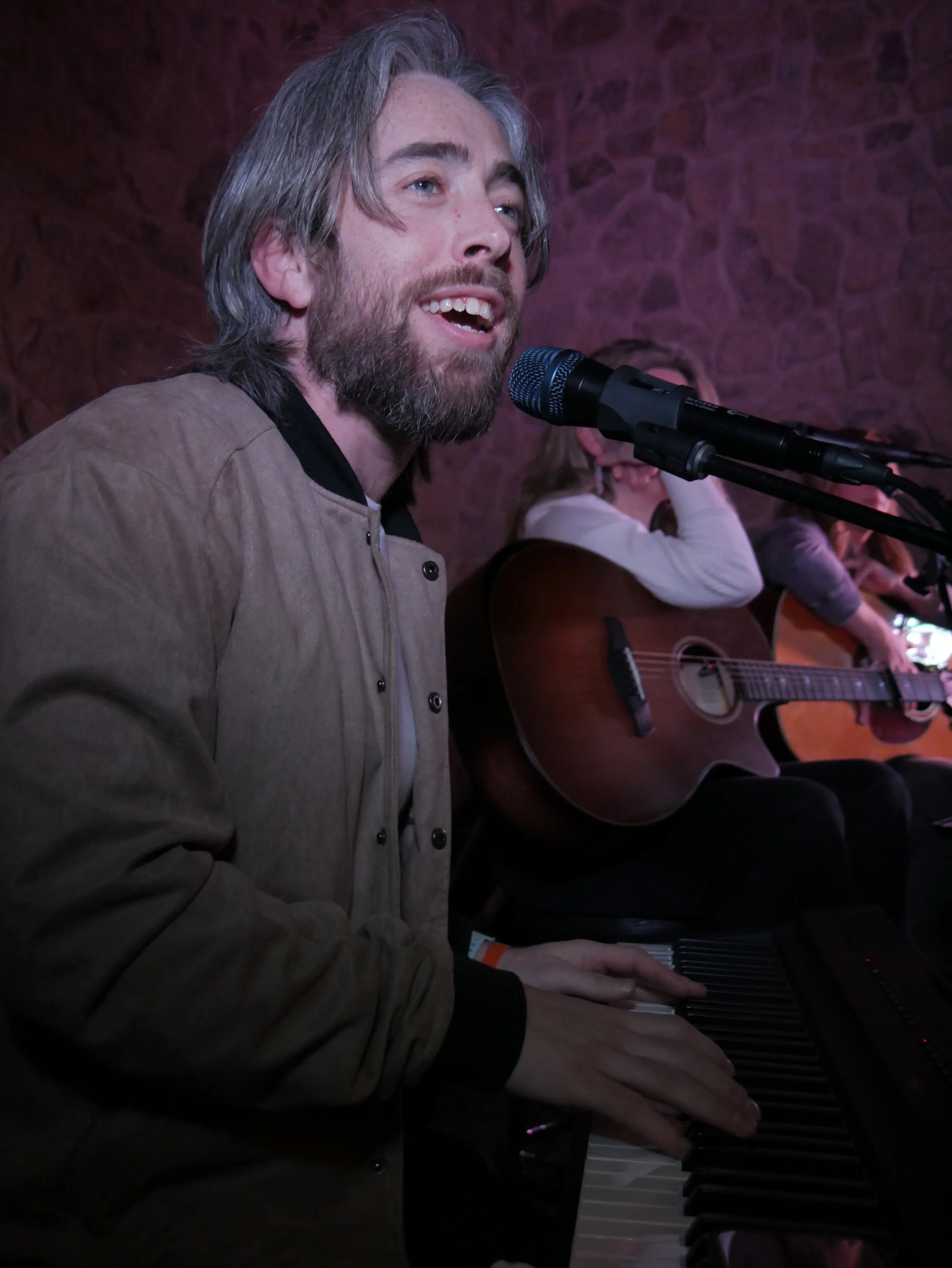 Cam Melton performing live as part of a songwriter's showcase at Moon Drops Distillery.
