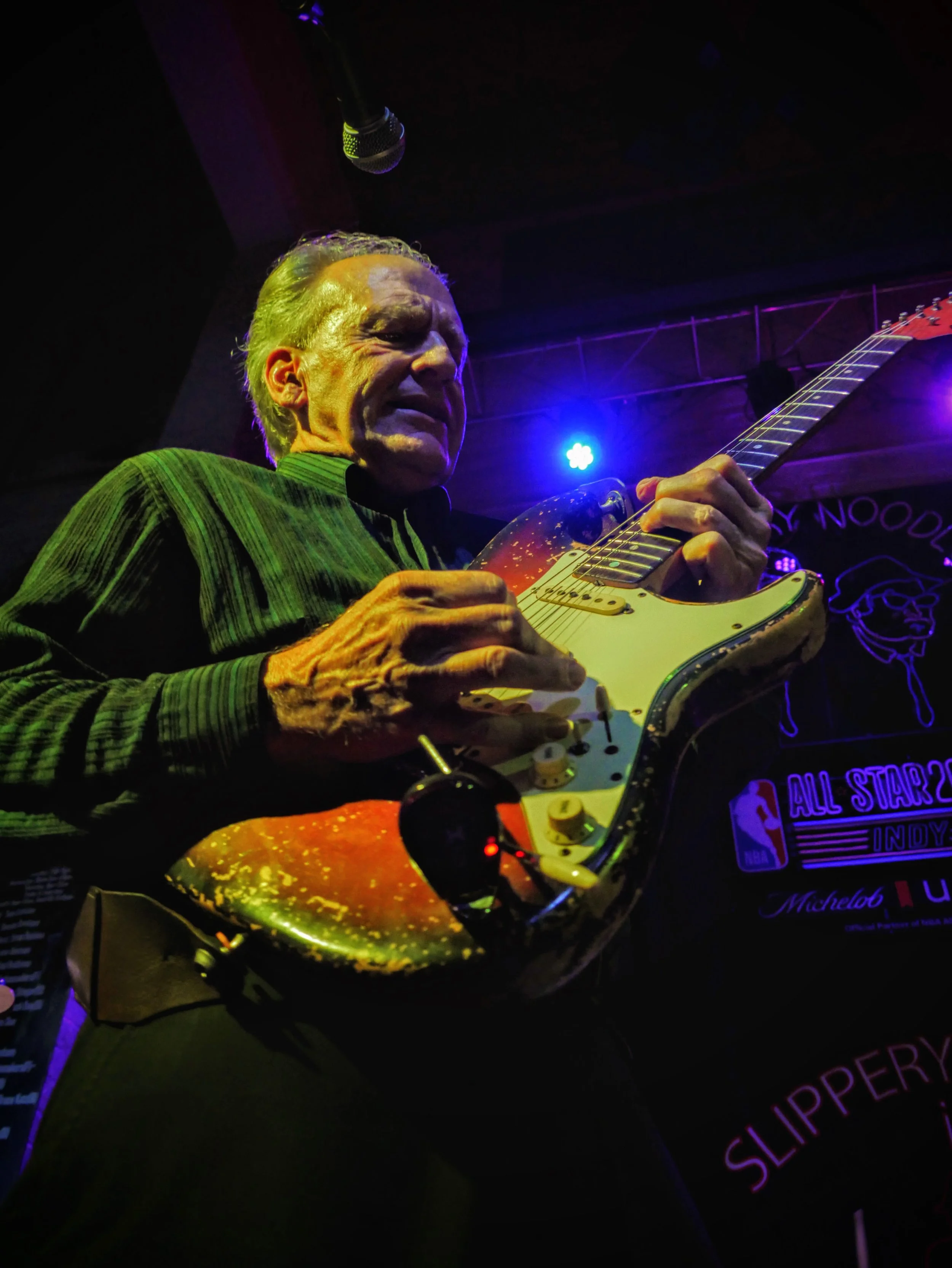 Steve Ray Robbins performing live on a classic Fender Stratocaster under the glowing lights of the world-famous Slippery Noodle in Indianapolis.