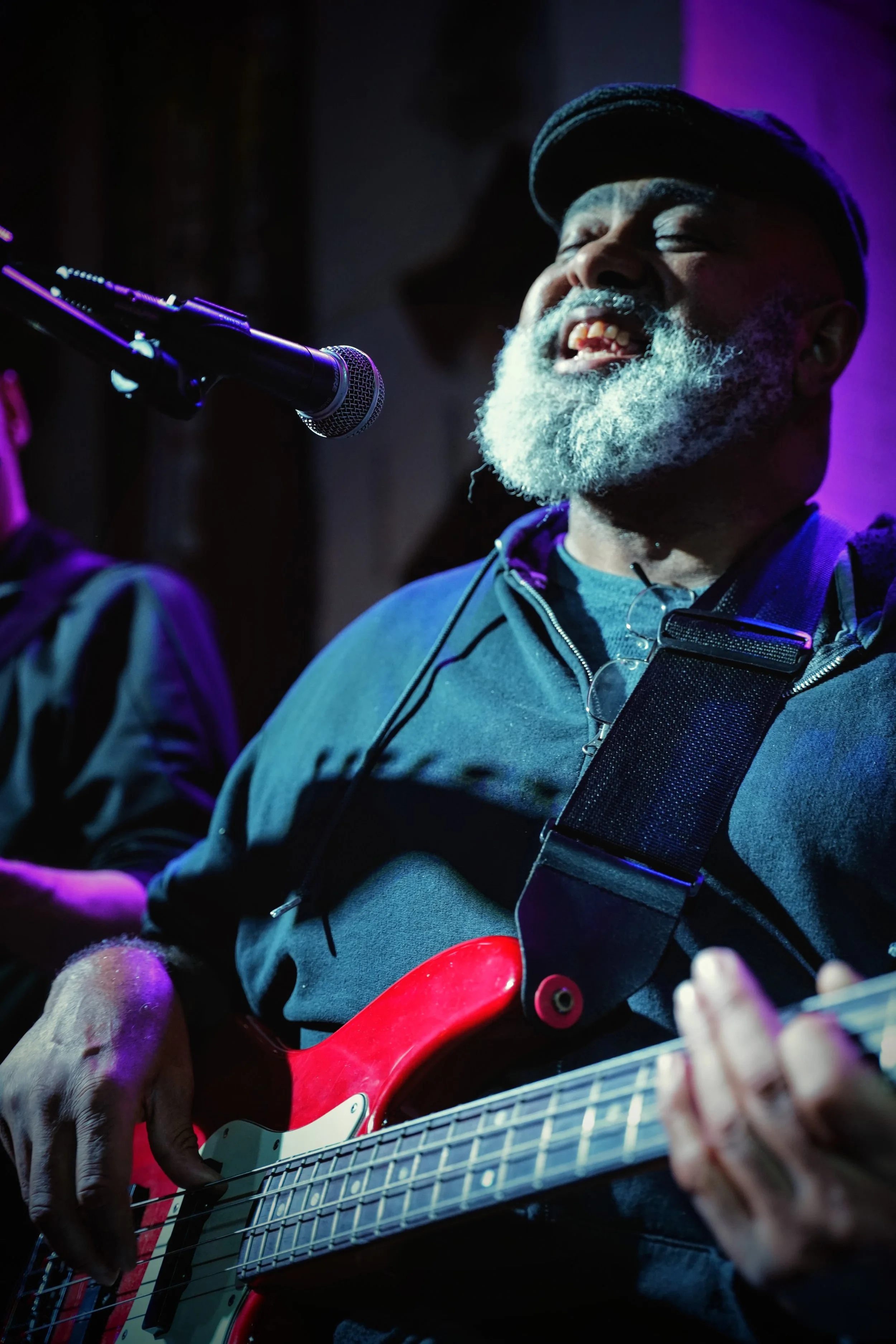 Jerome Mills singing with his full heart under the glowing lights of the world-famous Slippery Noodle in Indianapolis.