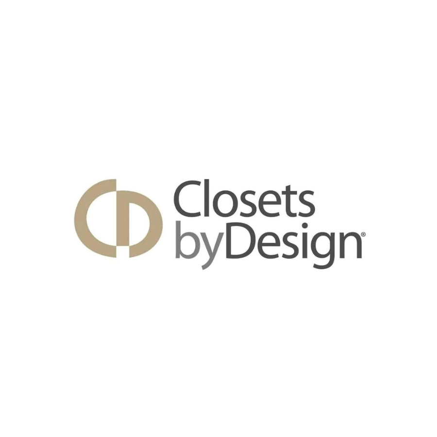 Logo for Closets by Design featuring a stylized circular emblem and black and gray text on a white background.