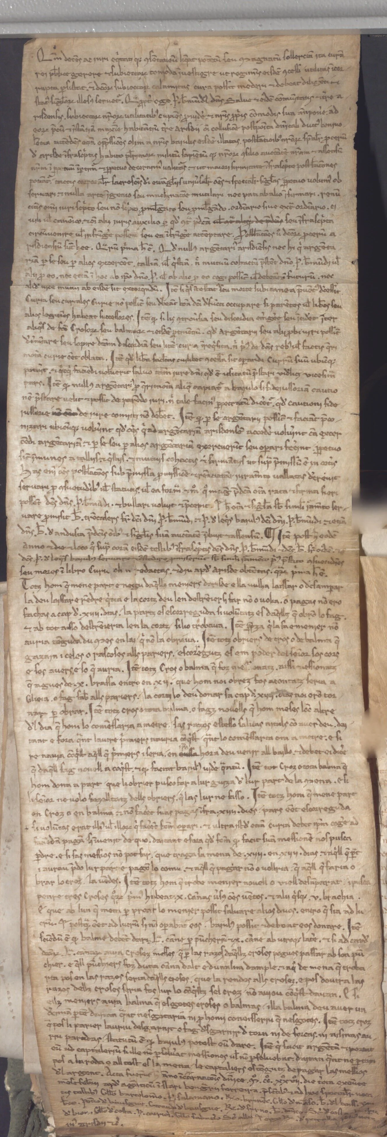 A historical manuscript page with handwritten Latin text on aged parchment. The text is densely packed, with some sections crossed out and marginal notes.