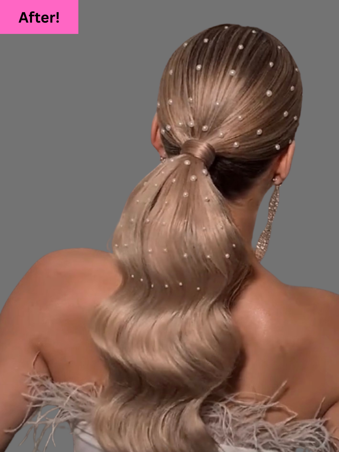Back view of a woman with long, blonde, wavy hair adorned with small pearls tied in a low ponytail, wearing earrings and a dress with feather details on the shoulder, against a gray background.