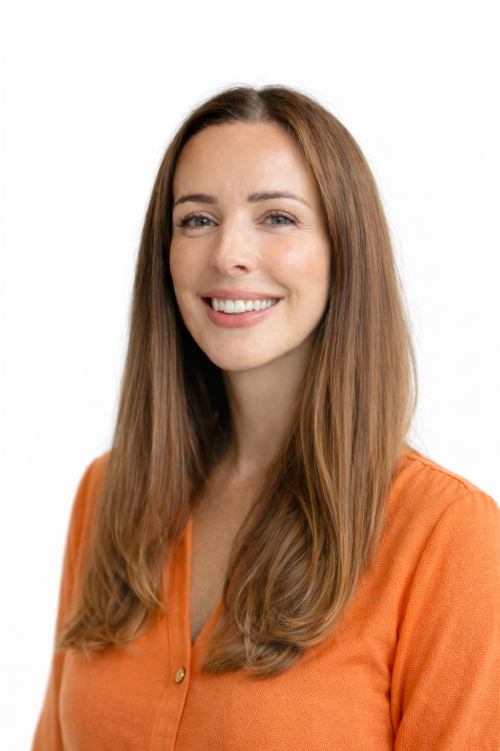 A woman with long brown hair smiling, wearing an orange shirt, against a white background.