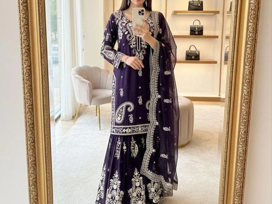 Step into effortless glamour with the Aarini Glam Sharara Set, crafted in pure fox georgette and adorned with delicate 5mm sequin embroidery for a radiant finish. The fully stitched top with elegant sleeves pairs beautifully with the flowy embroidere