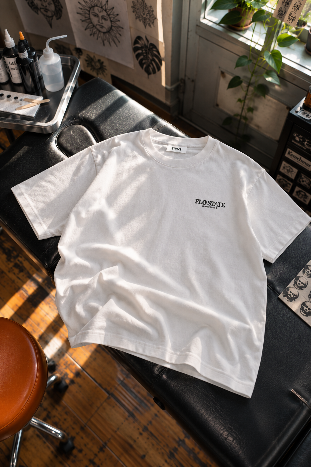 Sunlit Tattoo Studio T-Shirt Flatlay.png