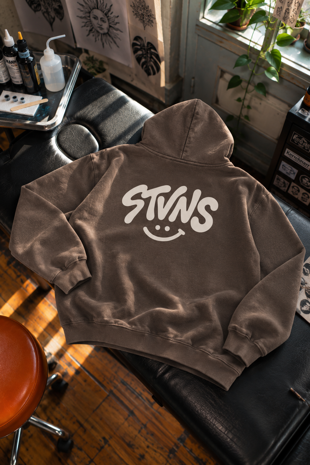 STVNS Hoodie in Sunlit Tattoo Studio.png