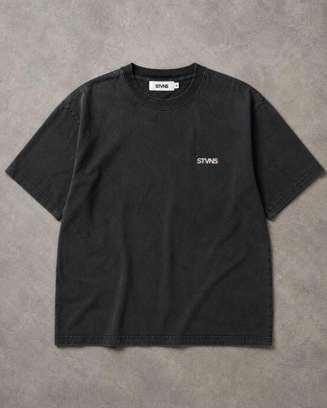 stvns-drop-001-ink-black-tee-flatlay front.jpg