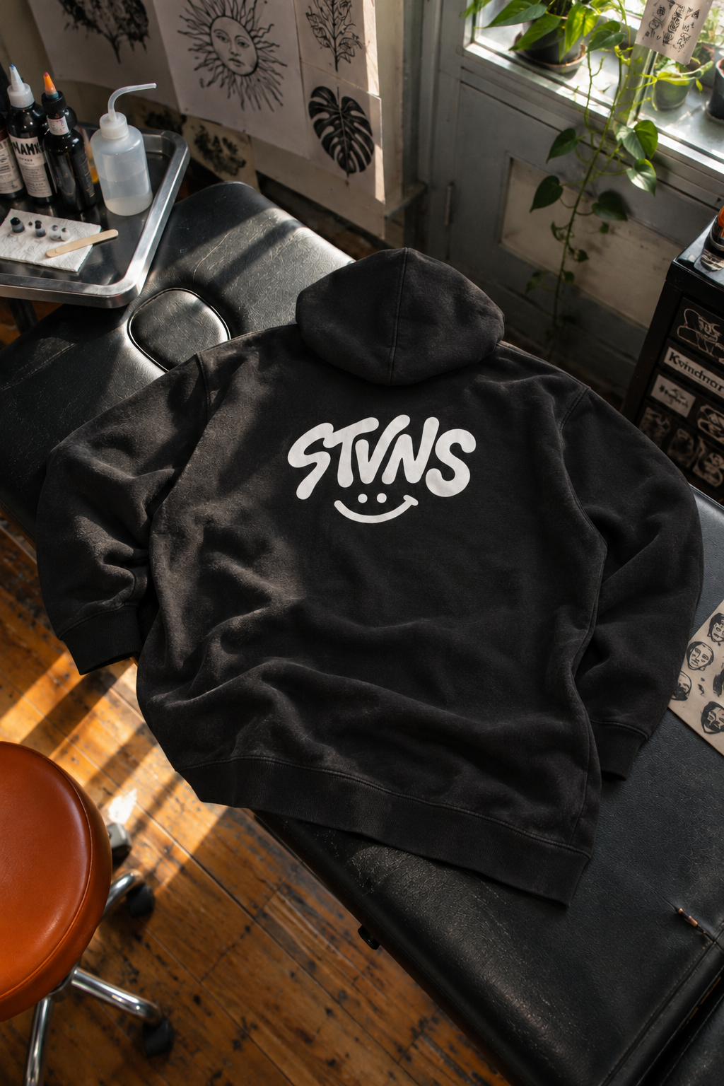STVNS black hoodie back flatlay-2.png