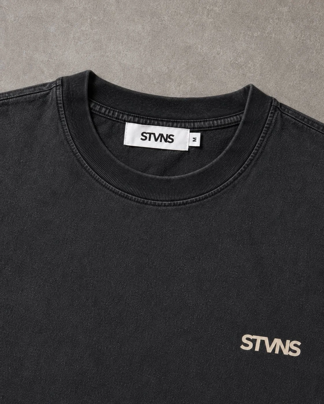 stvns-drop-001-ink-black-tee-flatlay label.jpg