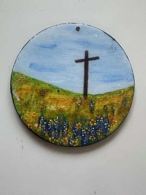 Cross on a Hill of Flowers