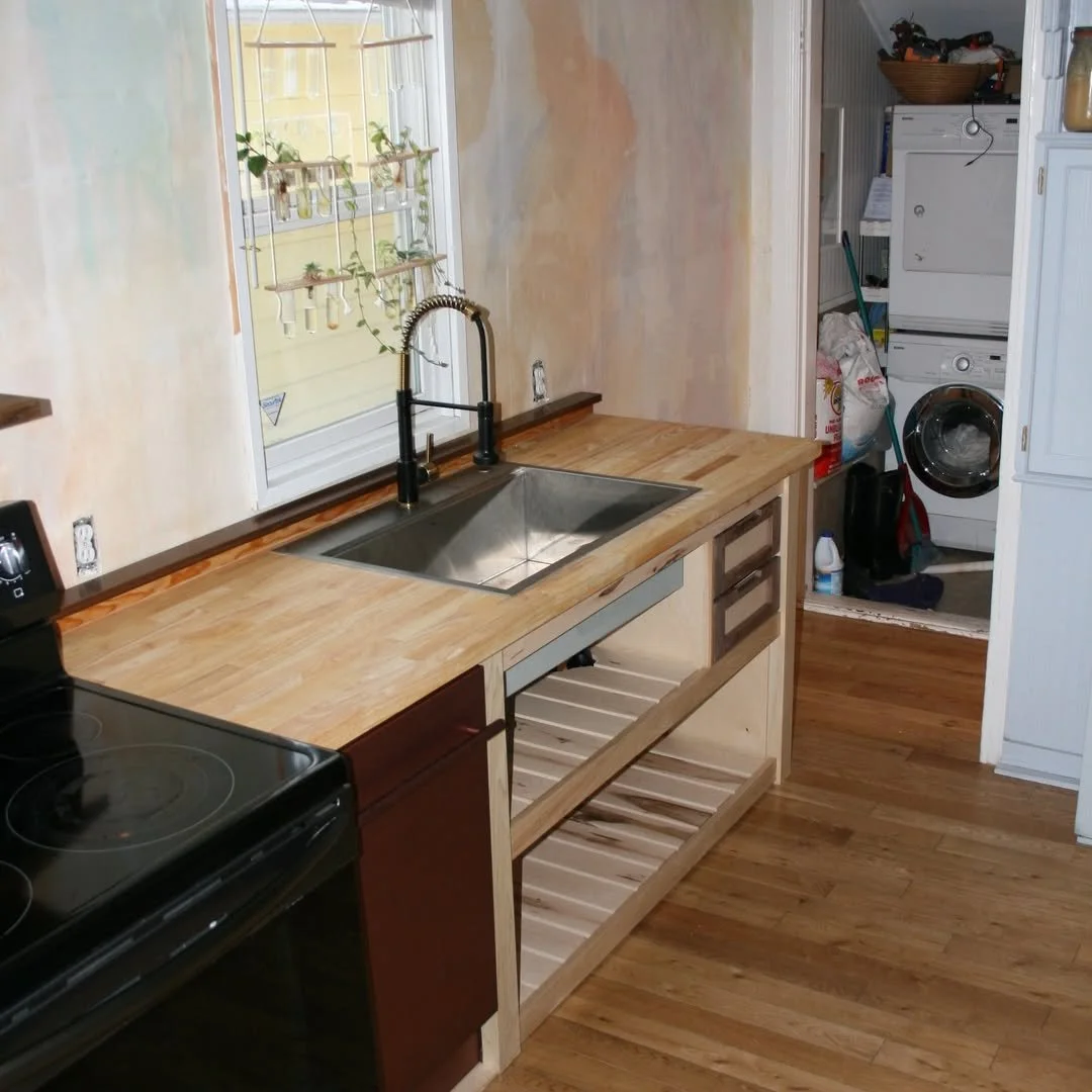 A small-footprint hand-built farm-style washing cabinet. Maple, Walnut, and a little bit of Fir to match the old house.