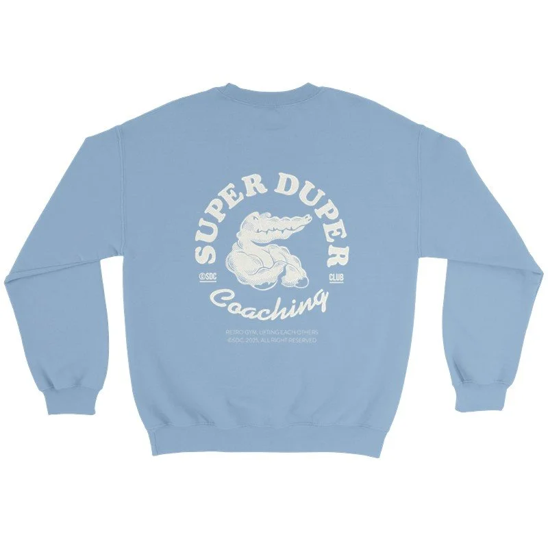 Sweat à capuche bleu clair avec un logo de crocodile musclé et le texte 'Super Duper Coaching'.