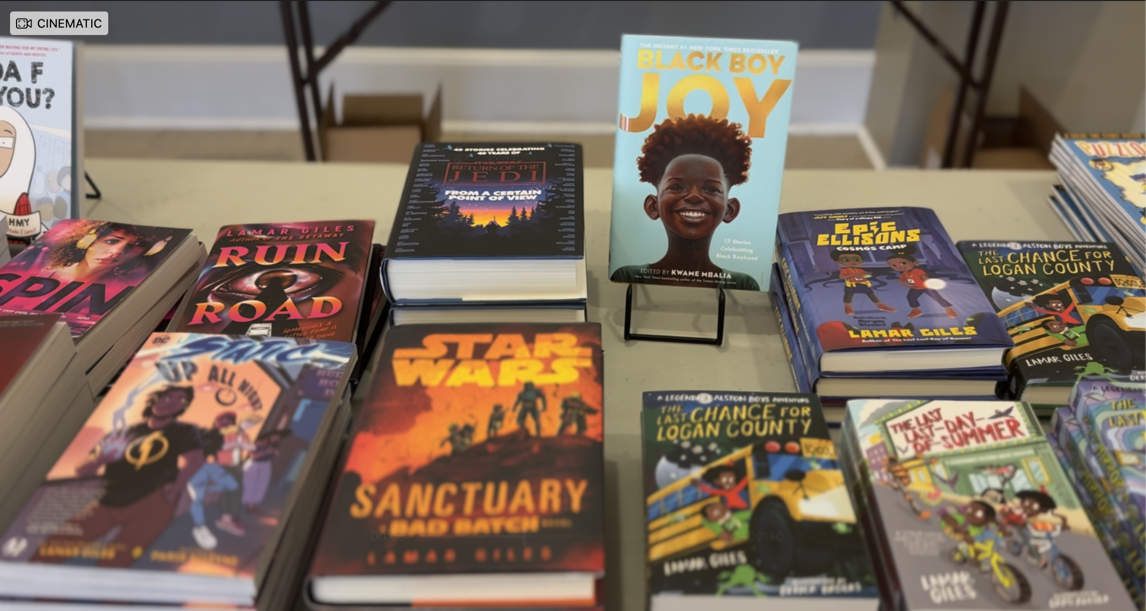 Display of several books by Lamar Giles including SPIN, RUIN ROAD, STATIC: UP ALL NIGHT, STAR WARS: SANCTUARY, THE LAST LAST DAY OF SUMMER, THE LAST MIRROR ON THE LEFT, THE LAST CHANCE FOR LOGAN COUNTY, and EPIC ELLISONS: COSMOS CAMP