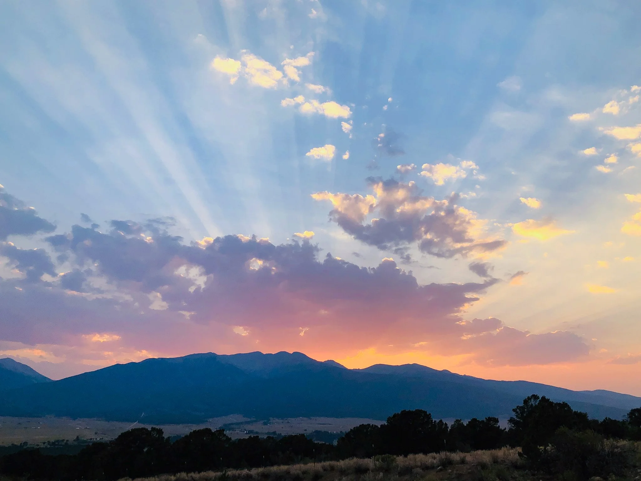 Sunlight breaking through clouds over the mountains near Buena Vista, Colorado