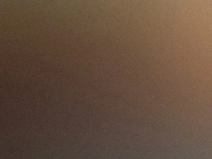 A mostly brown blurred background with no distinguishable objects or features.