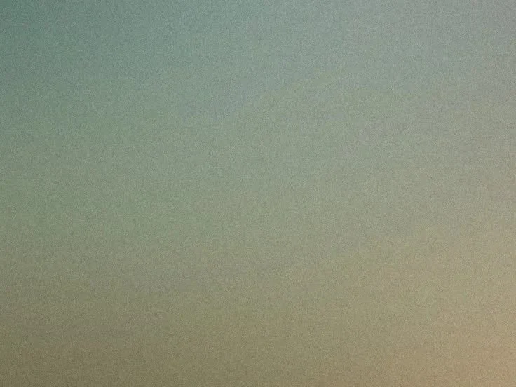 Empty sky with a gradient of greenish and beige tones.