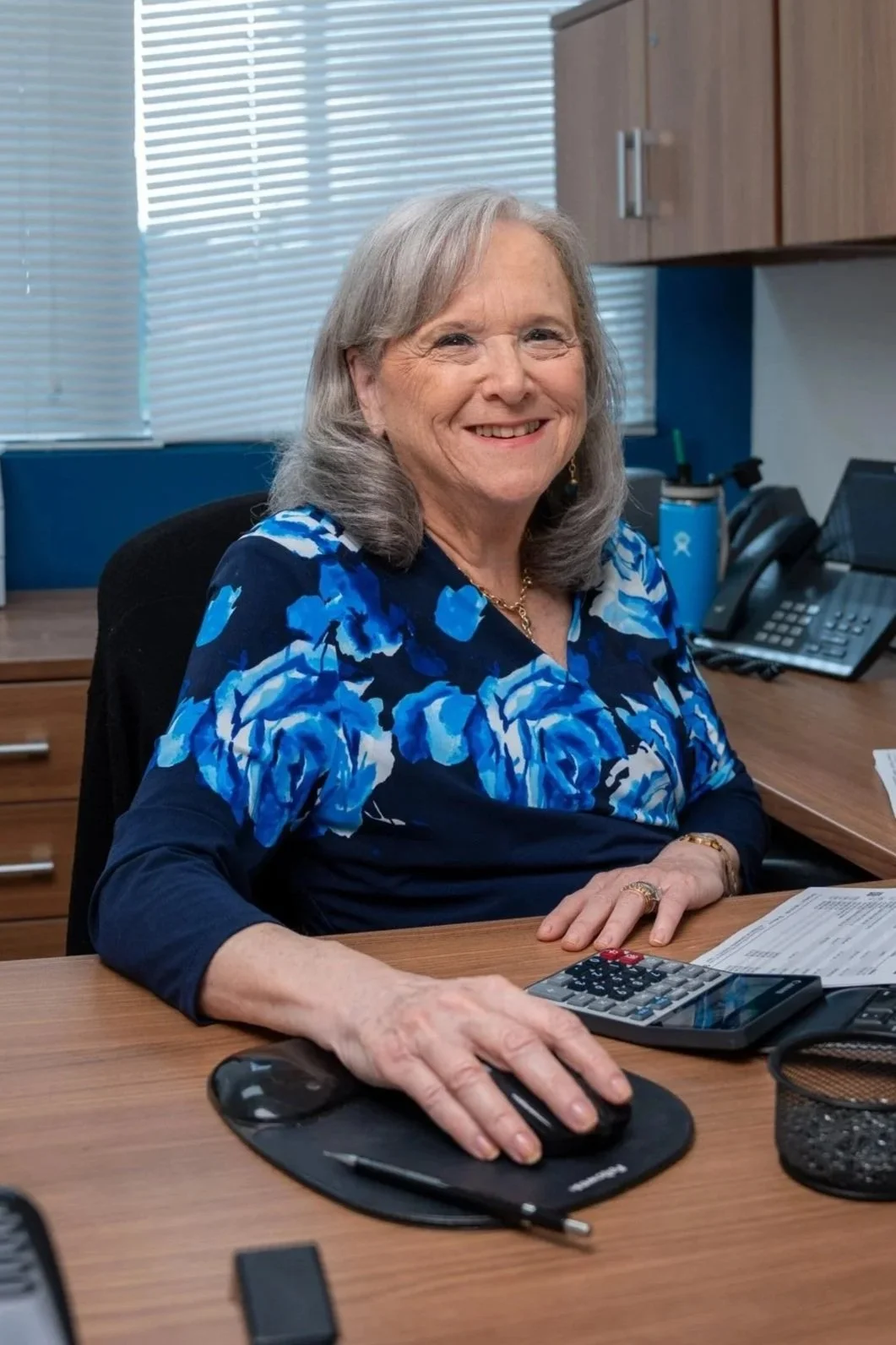 Photo of a lady working at her desk